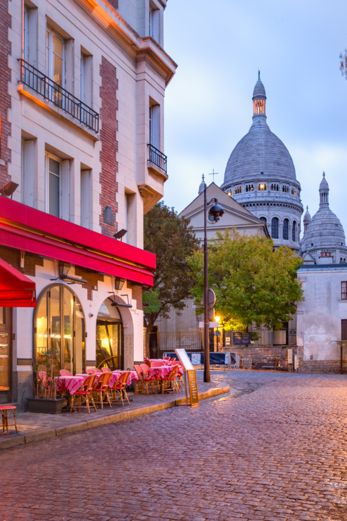 Stroll Montmartre at Sunrise: The artists' district feels like stepping back in time with cobblestone streets, cafés, and the Basilica of Sacré-Cœur.