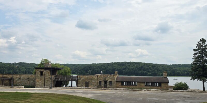 Historic stone buildings overlooking the lake at Lake Wapello State Park in Iowa