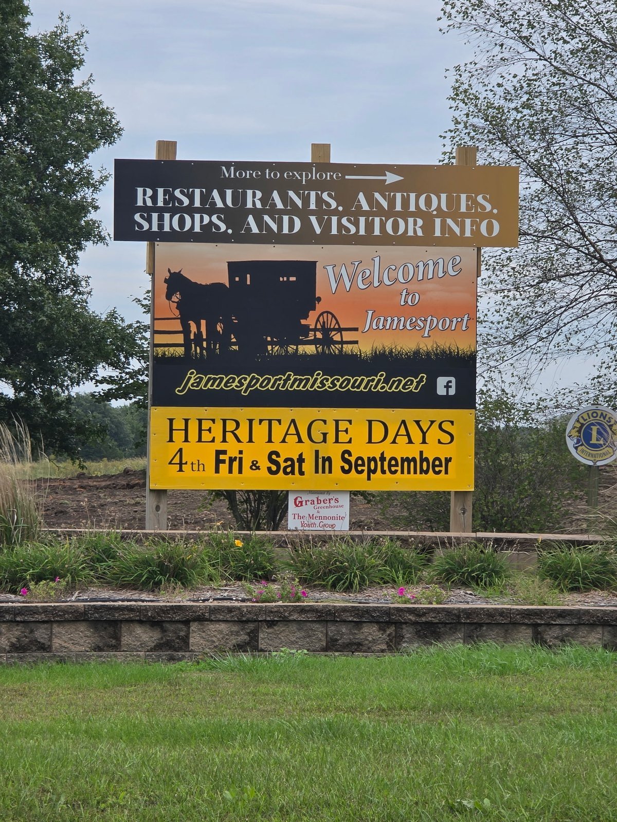 Welcome to Jamesport sign with Amish buggy silhouette and Heritage Days banner