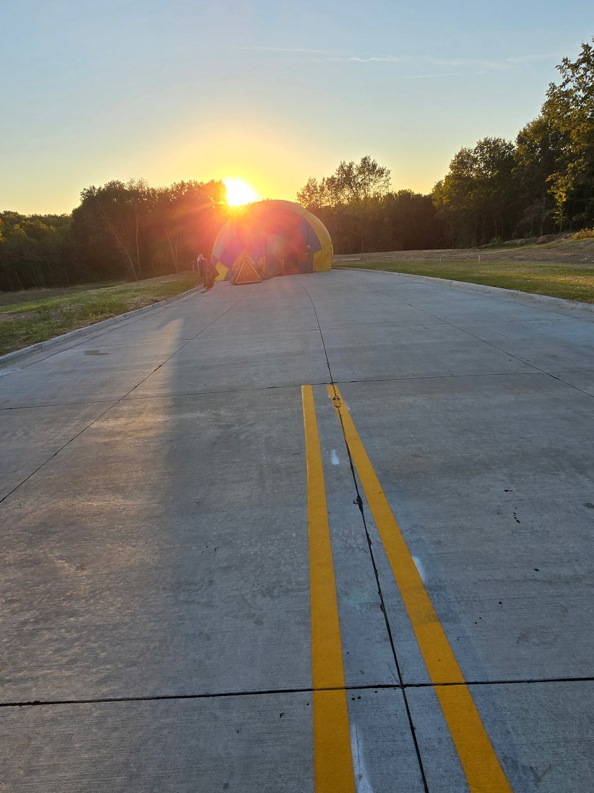 Hot air balloon envelope on a quiet road at sunset in Columbia, Missouri