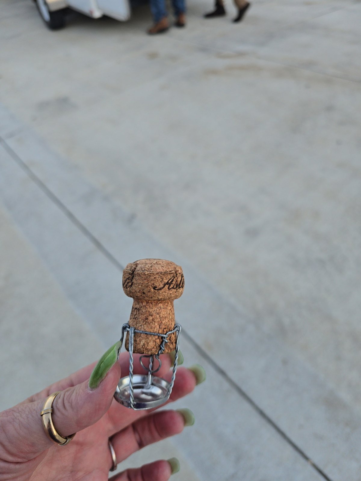 Champagne cork with wire cage held after a hot air balloon landing