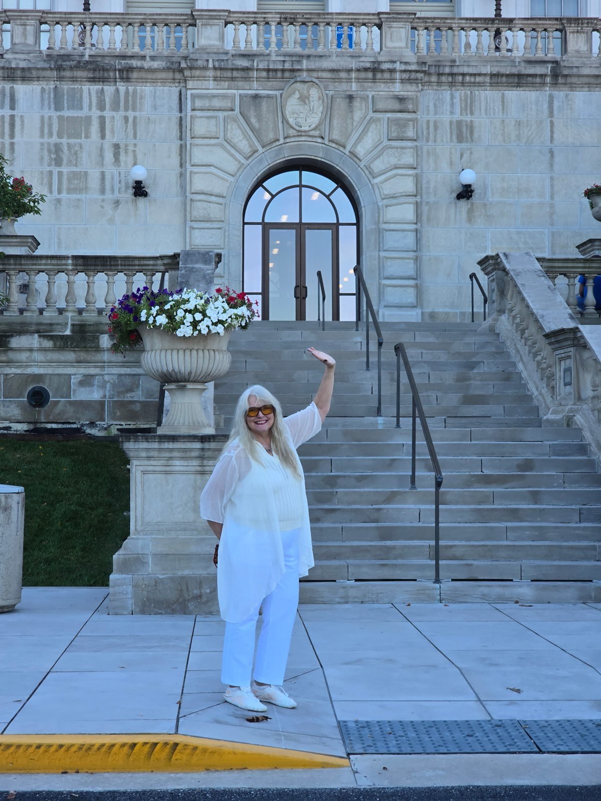 Mom waving on the steps of a Missouri Capitol entrance