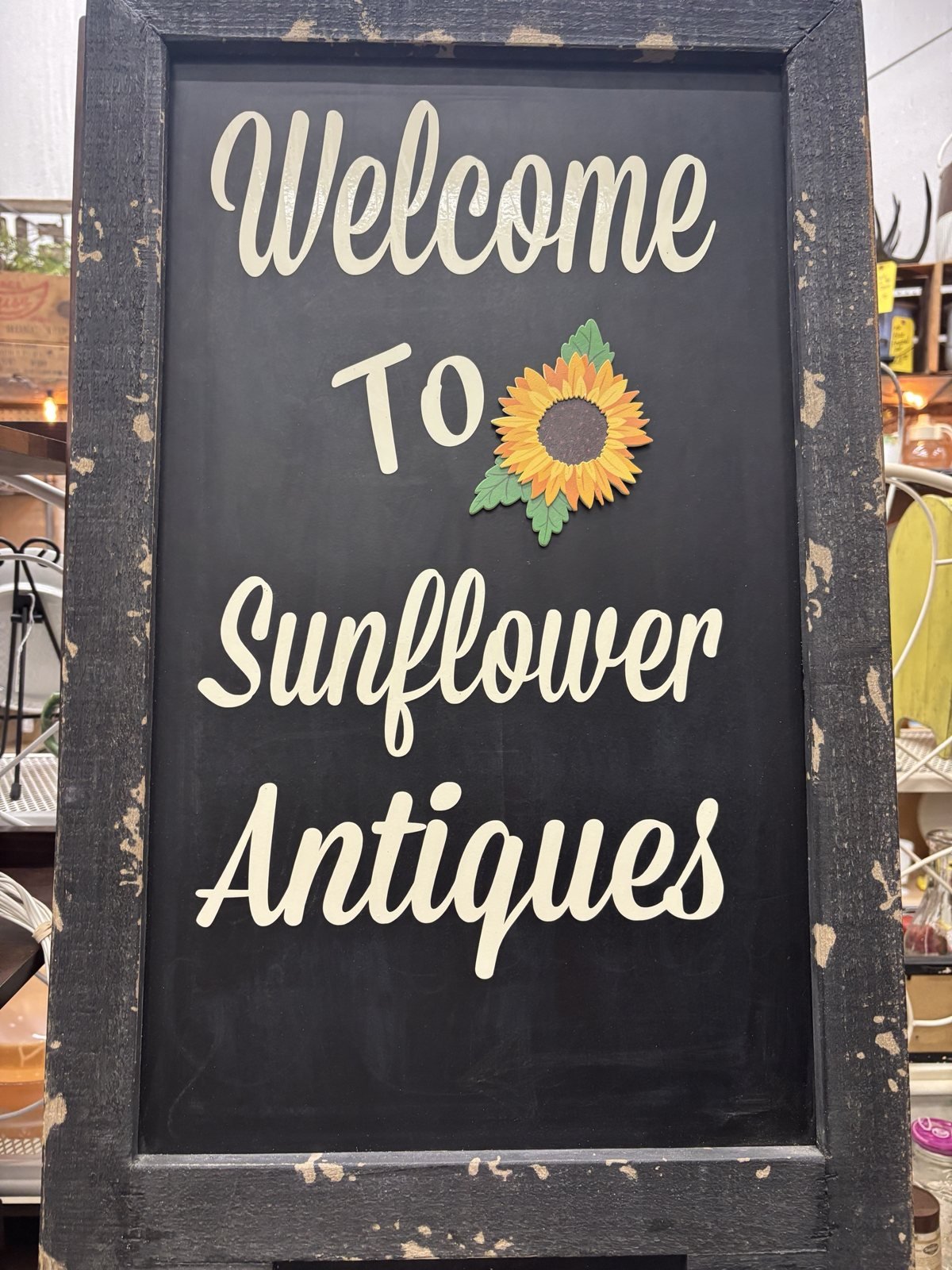 Welcome to Sunflower Antiques chalkboard sign in Jefferson City